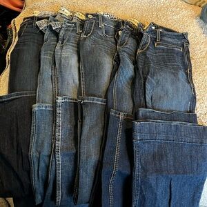 Lot of six like new Ariat Denim jeans 26 extra long. One pair of trouser style